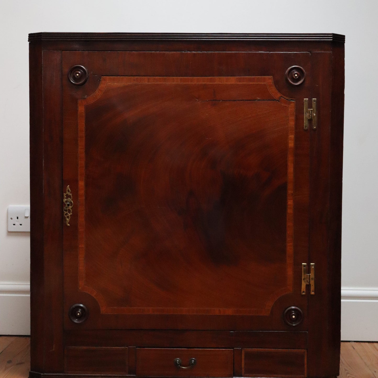 Antique mahogany corner cupboard