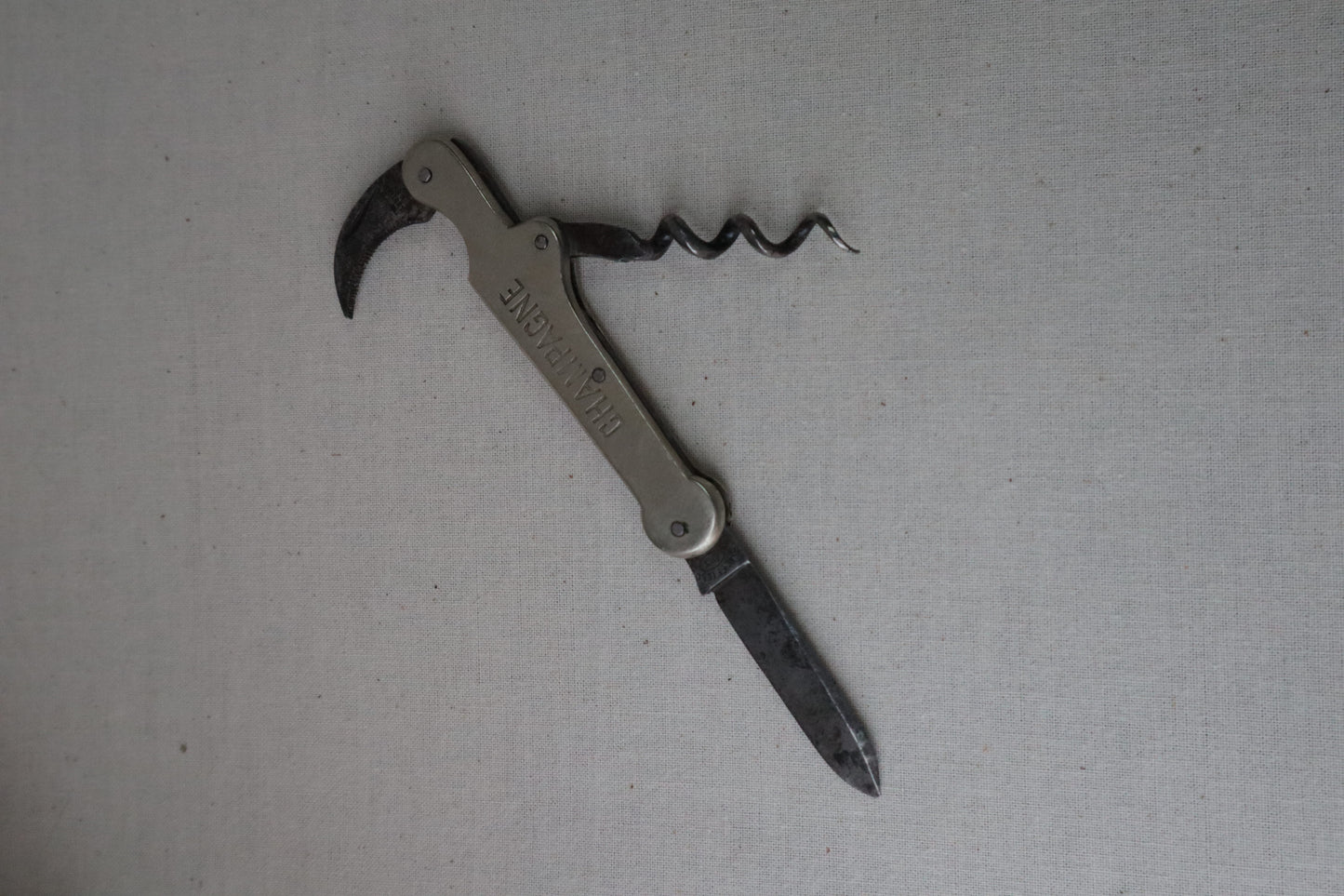 Silvered bottle opener