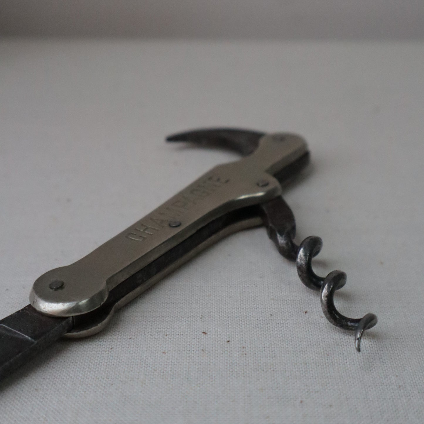 Silvered bottle opener