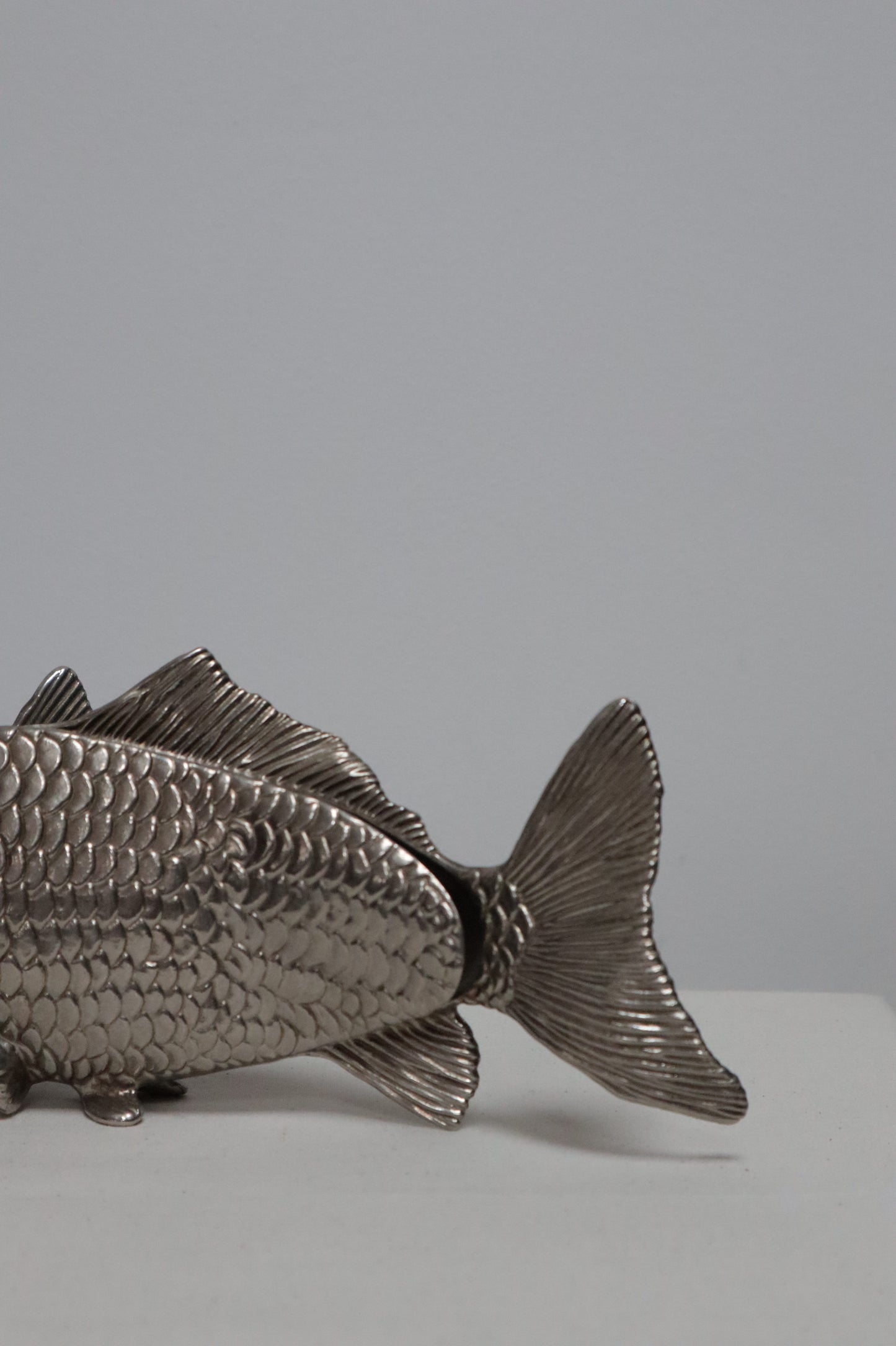 Silvered fish menu holder