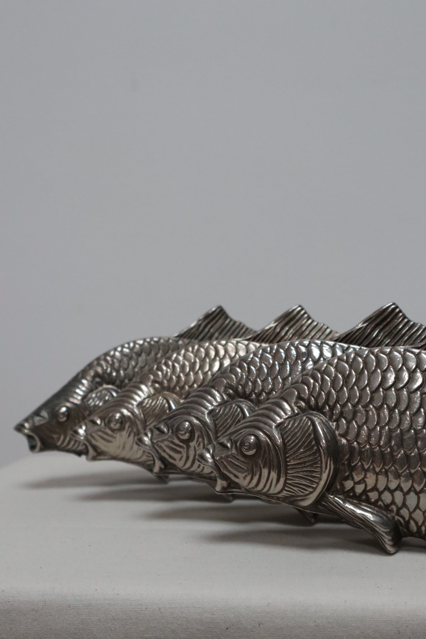 Silvered fish menu holder