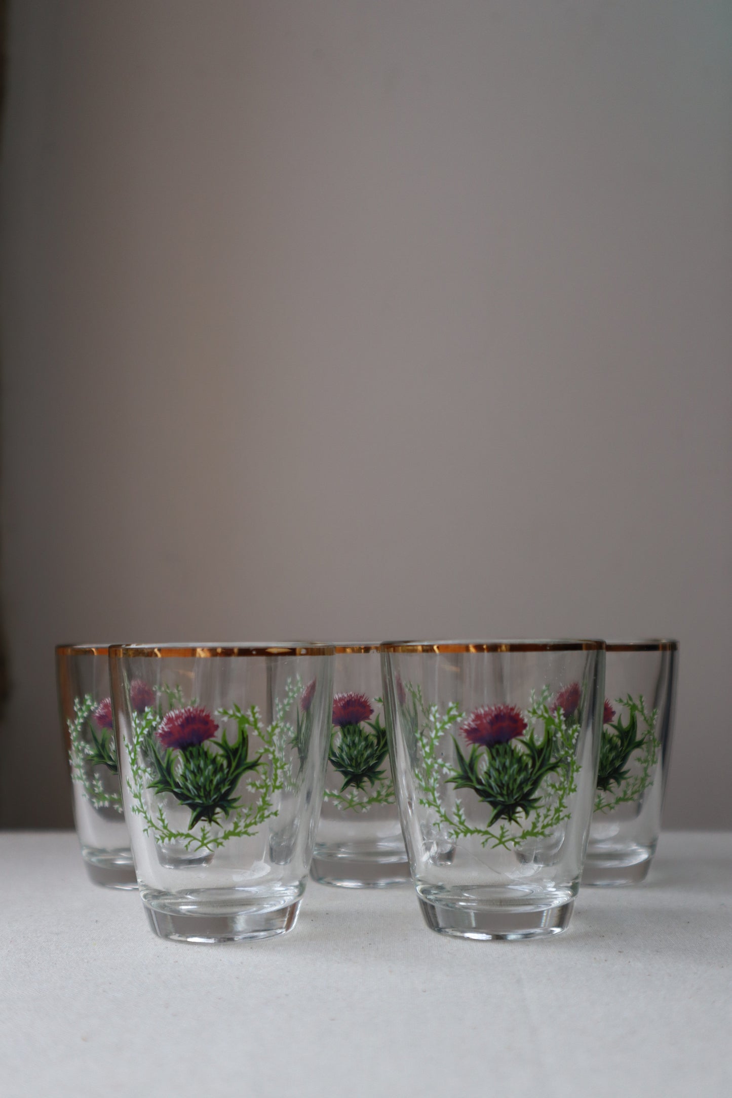 Shot glass with painted thistle