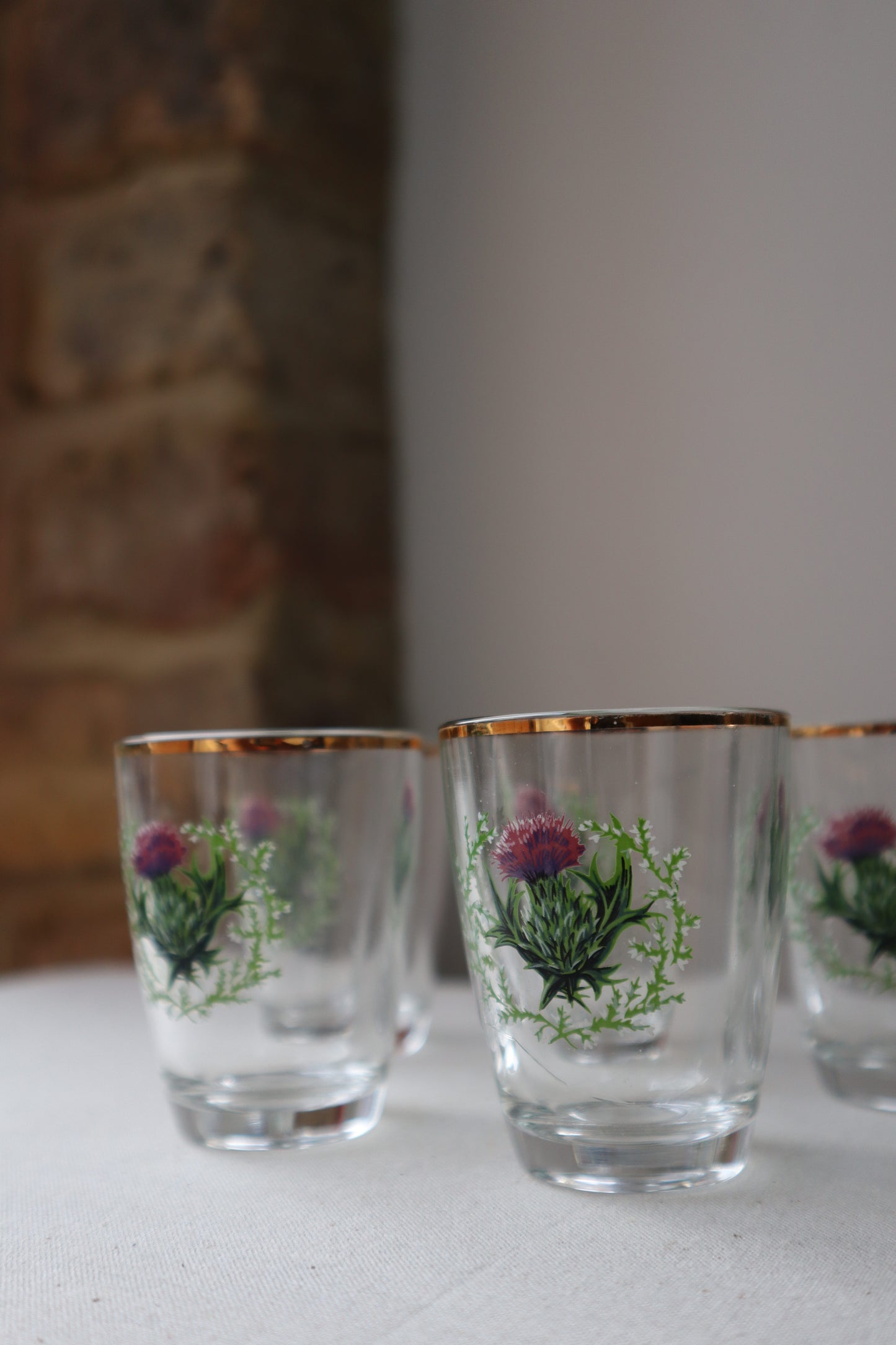 Shot glass with painted thistle