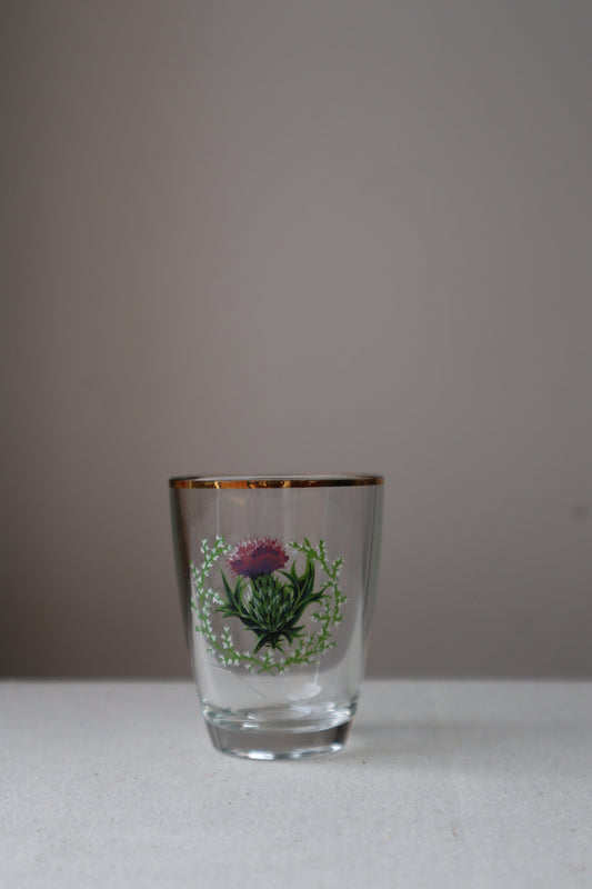 Shot glass with painted thistle