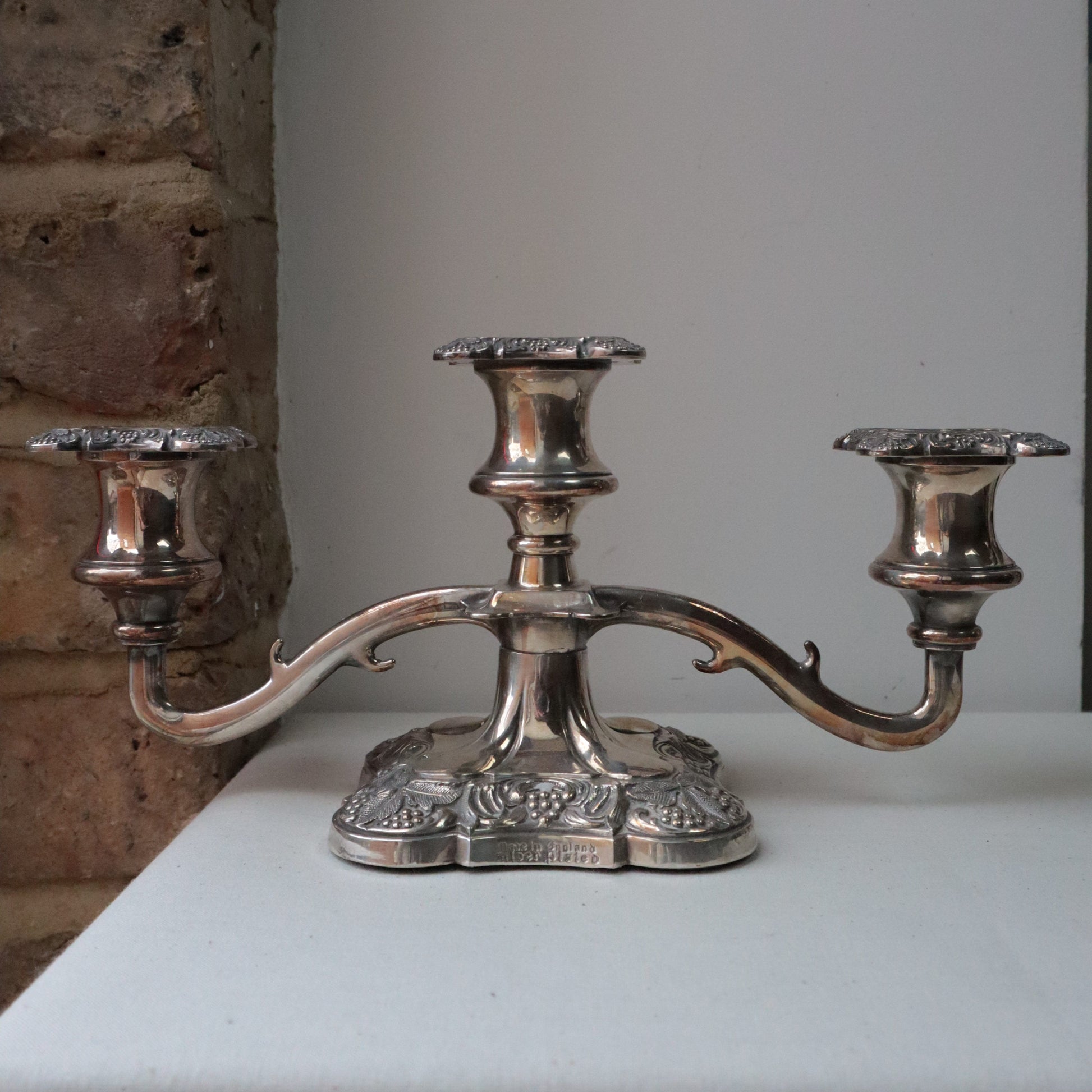 An ornate silvered decorative candelabra