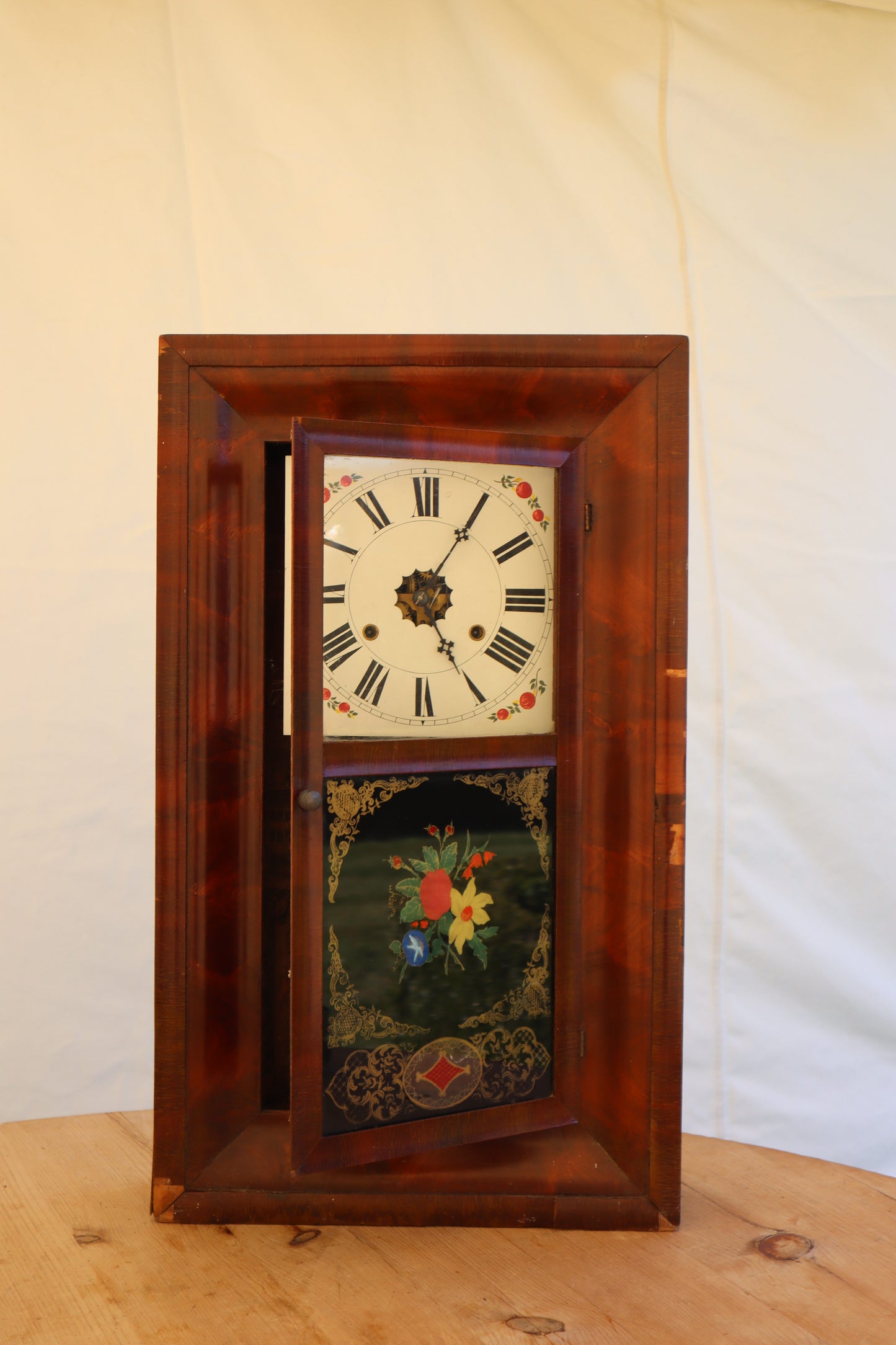 Wall clock with painted panel