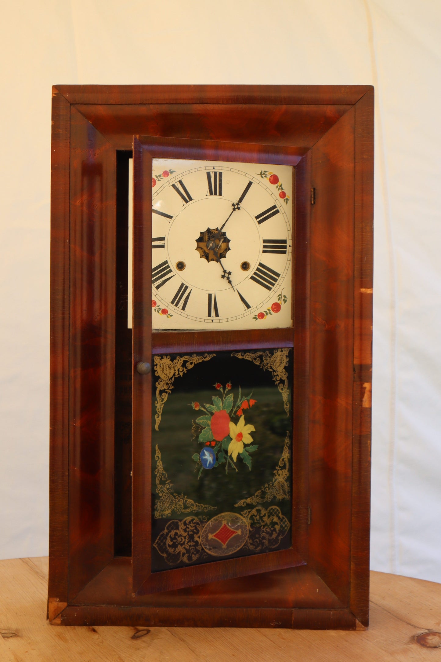 Wall clock with painted panel