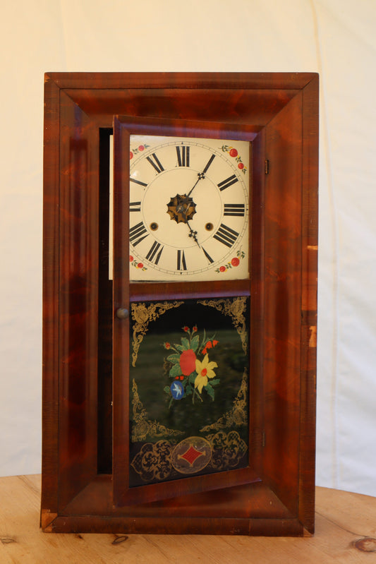 Wall clock with painted panel