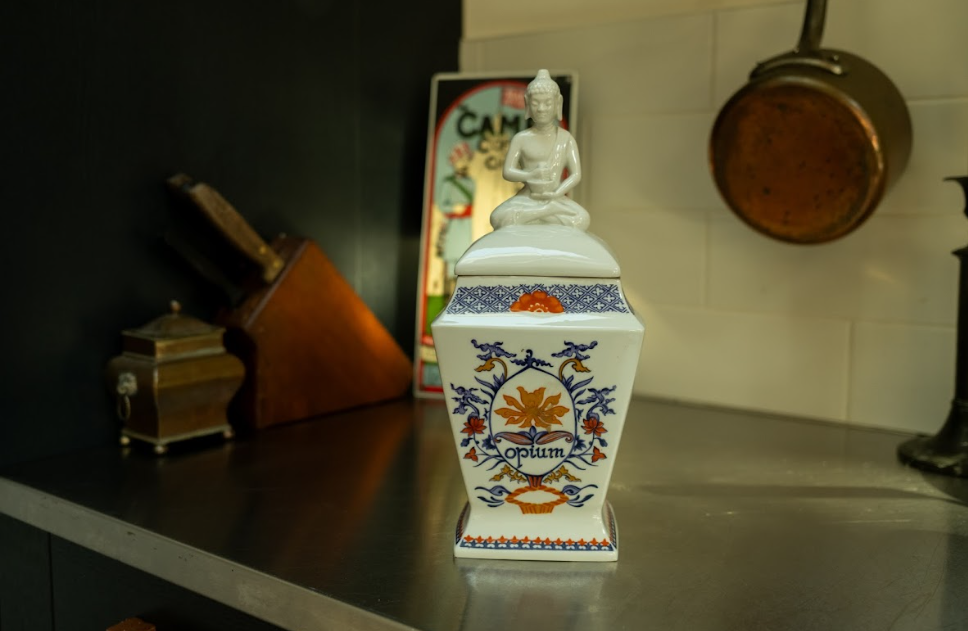 Ceramic lidded jar with Buddha