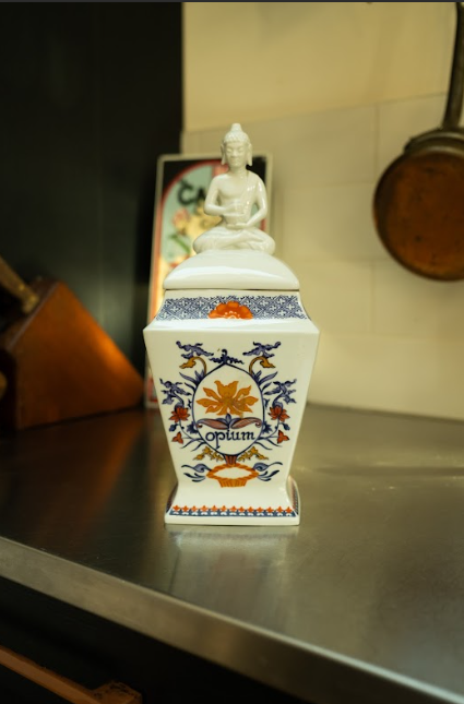Ceramic lidded jar with Buddha